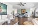 Bright living room featuring hardwood floors, high ceilings, stylish furniture, and ample natural light at 2304 Pointe Marsh Ln., North Myrtle Beach, SC 29582