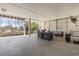 Spacious covered outdoor patio furnished with comfortable seating, ideal for relaxation and entertaining at 2304 Pointe Marsh Ln., North Myrtle Beach, SC 29582