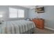 Inviting bedroom with a comfy bed, lots of natural light, and a calming color scheme at 2405 S Ocean Blvd. # 105, North Myrtle Beach, SC 29582