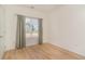 Well lit bedroom featuring wood-style floors and a window with nice curtains at 245 Maiden'S Choice Dr., Conway, SC 29527