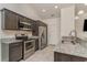 Modern kitchen features stainless steel appliances, granite countertops, and dark wood cabinetry at 245 Maiden'S Choice Dr., Conway, SC 29527