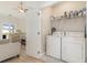 Modern laundry room with washer, dryer and wire shelving. Overlooks the living room at 245 Maiden'S Choice Dr., Conway, SC 29527