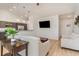 Cozy living room with modern furniture, hardwood floors, and an open layout to the kitchen at 245 Maiden'S Choice Dr., Conway, SC 29527
