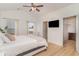 Bright main bedroom featuring wood floors, ceiling fan, and a walk-in closet at 245 Maiden'S Choice Dr., Conway, SC 29527