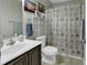 Cozy bathroom with shower-tub combination and ocean-themed shower curtain at 248 Upper Saddle Circle, Conway, SC 29526