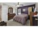 This bedroom features dark accent wall, ceiling fan, carpet floors, and natural light at 248 Upper Saddle Circle, Conway, SC 29526