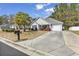Exterior of a quaint home showing the driveway and mailbox at 248 Upper Saddle Circle, Conway, SC 29526