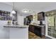 Kitchen area with stainless steel appliances and dark cabinets at 248 Upper Saddle Circle, Conway, SC 29526