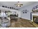 Cozy living room with hardwood floors, fireplace, and modern decor at 248 Upper Saddle Circle, Conway, SC 29526
