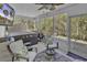 This sunroom features a ceiling fan, hot tub, and view of the yard at 248 Upper Saddle Circle, Conway, SC 29526