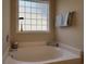 Bathroom showcasing soaking tub next to frosted window, great for a refreshing bath at 280 Barclay Dr., Myrtle Beach, SC 29579