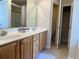 Bathroom featuring double sink vanity with cabinets, open toilet area, and linen closet for optimal storage at 280 Barclay Dr., Myrtle Beach, SC 29579