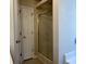 Enclosed shower and frosted glass with metal frame, next to a white door with gold colored handle at 280 Barclay Dr., Myrtle Beach, SC 29579