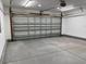 Clean and organized garage with metal door, showcasing an efficient storage space at 280 Barclay Dr., Myrtle Beach, SC 29579