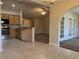 Open kitchen overlooking the living room and sunroom through archways at 280 Barclay Dr., Myrtle Beach, SC 29579