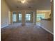 Bright living room with a view to a sunroom and kitchen at 280 Barclay Dr., Myrtle Beach, SC 29579
