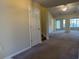 Spacious living room with neutral carpet and views to other rooms at 280 Barclay Dr., Myrtle Beach, SC 29579