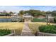 Picturesque backyard featuring a covered dock and direct access to the waterfront at 288 Rum Gully Rd., Murrells Inlet, SC 29576