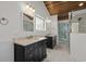 This bathroom features double sinks with marble counters and black cabinets at 288 Rum Gully Rd., Murrells Inlet, SC 29576