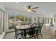 Sun-drenched breakfast room featuring large windows with views of the lake and a stylish dining set at 288 Rum Gully Rd., Murrells Inlet, SC 29576