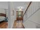 Bright and welcoming entryway with hardwood floors and staircase at 288 Rum Gully Rd., Murrells Inlet, SC 29576