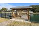 Wooden gazebo on dock overlooking the water with built-in bench at 288 Rum Gully Rd., Murrells Inlet, SC 29576