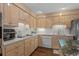 Well-equipped kitchen with stainless steel appliances, tile backsplash, and plentiful cabinet space at 288 Rum Gully Rd., Murrells Inlet, SC 29576