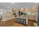 Bright kitchen with a center island with seating, custom cabinetry, and an open layout at 288 Rum Gully Rd., Murrells Inlet, SC 29576
