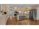 Spacious kitchen with stainless steel appliances, ample counter space, and a central island with bar stools at 288 Rum Gully Rd., Murrells Inlet, SC 29576