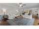 Spacious living room featuring hardwood floors, comfortable sofas, and access to the kitchen at 288 Rum Gully Rd., Murrells Inlet, SC 29576