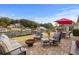 Inviting outdoor patio with comfortable seating, a fire pit, and scenic water views at 288 Rum Gully Rd., Murrells Inlet, SC 29576