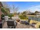 Backyard patio featuring a grill, outdoor seating, fire pit, and waterfront view at 288 Rum Gully Rd., Murrells Inlet, SC 29576