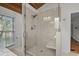 This large walk-in shower has a seat and tiled walls at 288 Rum Gully Rd., Murrells Inlet, SC 29576