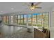 Bright sun room with panoramic views of the lake, offering a serene space for relaxation at 288 Rum Gully Rd., Murrells Inlet, SC 29576