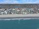 The aerial view showcases the building's prime location near the beach and local points of interest at 301 N Waccamaw Dr. # 209, Garden City Beach, SC 29576