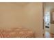 Bright bedroom offering a comfortable bed, view into the primary bedroom and a washing machine at 301 N Waccamaw Dr. # 209, Garden City Beach, SC 29576