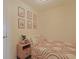 Charming bedroom with stylish bedding, decorative wall art, and a nightstand with storage at 301 N Waccamaw Dr. # 209, Garden City Beach, SC 29576
