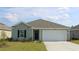 Charming single-story home with a well-manicured lawn and an attached one-car garage at 303 Clear Lake Dr., Conway, SC 29526