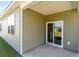 Cozy covered patio with a sliding glass door leading to the backyard at 303 Clear Lake Dr., Conway, SC 29526