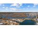 Aerial view showcasing waterfront homes nestled along a channel with stunning views of the marsh under a blue, partly cloudy sky at 310 37Th Ave. N, North Myrtle Beach, SC 29582