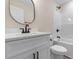 Bathroom featuring a white vanity with a dark faucet, toilet, and a shower at 3329 Hughes Gasque Rd., Aynor, SC 29511