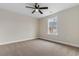 Comfortable bedroom featuring carpet, ceiling fan, and a window overlooking the yard at 3329 Hughes Gasque Rd., Aynor, SC 29511