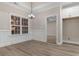 Bright dining room features panel molding, a modern chandelier, and luxury vinyl flooring at 3329 Hughes Gasque Rd., Aynor, SC 29511