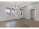 Dining room with wainscoting, large windows, and hardwood floors, perfect for entertaining at 3329 Hughes Gasque Rd., Aynor, SC 29511