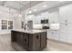 Bright kitchen features white cabinets, stainless steel appliances, and a large island at 3329 Hughes Gasque Rd., Aynor, SC 29511