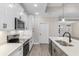 Bright kitchen featuring white cabinets, stainless steel appliances, and quartz countertops at 3329 Hughes Gasque Rd., Aynor, SC 29511