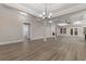 Inviting living area showcasing hardwood floors, coffered ceilings, and a cozy fireplace at 3329 Hughes Gasque Rd., Aynor, SC 29511