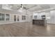 Open-concept living area with hardwood floors, coffered ceilings, and an island kitchen at 3329 Hughes Gasque Rd., Aynor, SC 29511