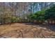 Secluded backyard surrounded by mature trees, offering a tranquil and private outdoor space at 3604 Brampton Dr., Myrtle Beach, SC 29588