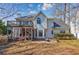 Backyard featuring a screened porch and deck, with lush greenery and a well-maintained lawn at 3604 Brampton Dr., Myrtle Beach, SC 29588
